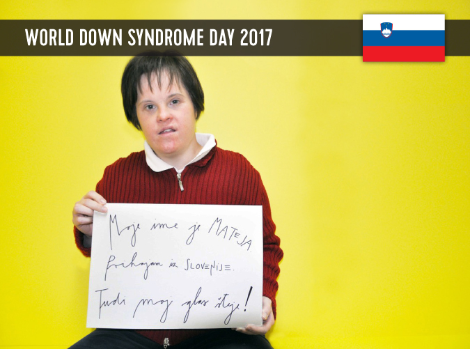 Young Slovenian woman with DS, holding a sign in her hands with a statement on WDSD 2017