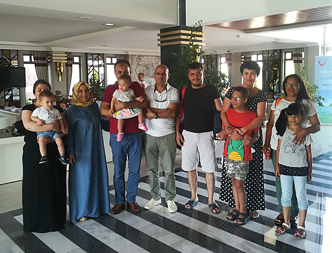 Tania Mykhailenko and her son Lev meeting up with three Turkish families.